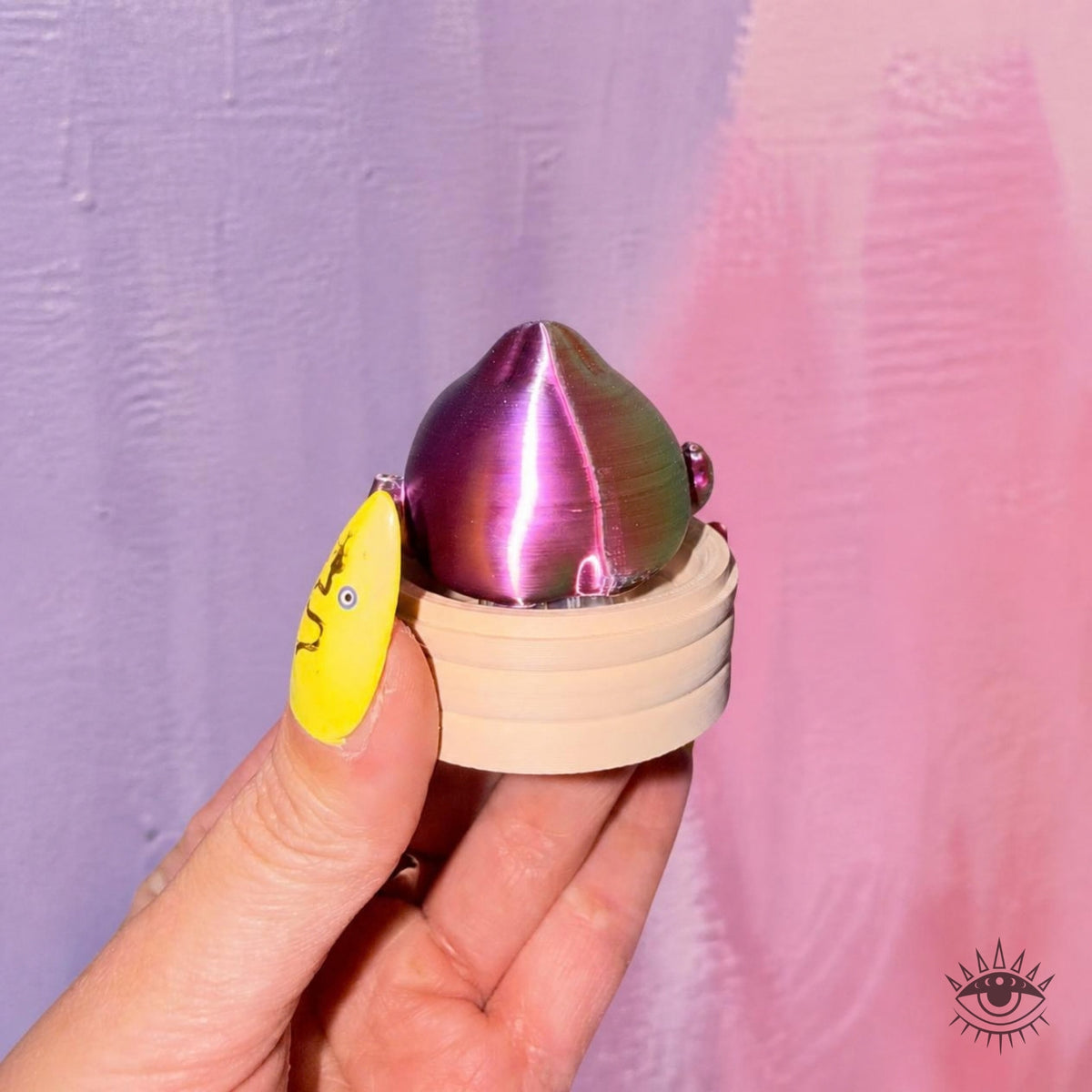 Hand holding Mystery Dumpling Clicker